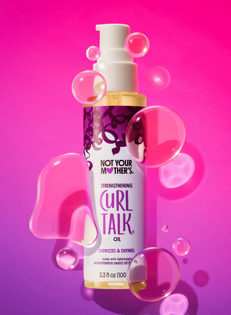 A bottle of Not Your Mother's Curl Talk Oil against a pink background with floating pink and clear bubbles.