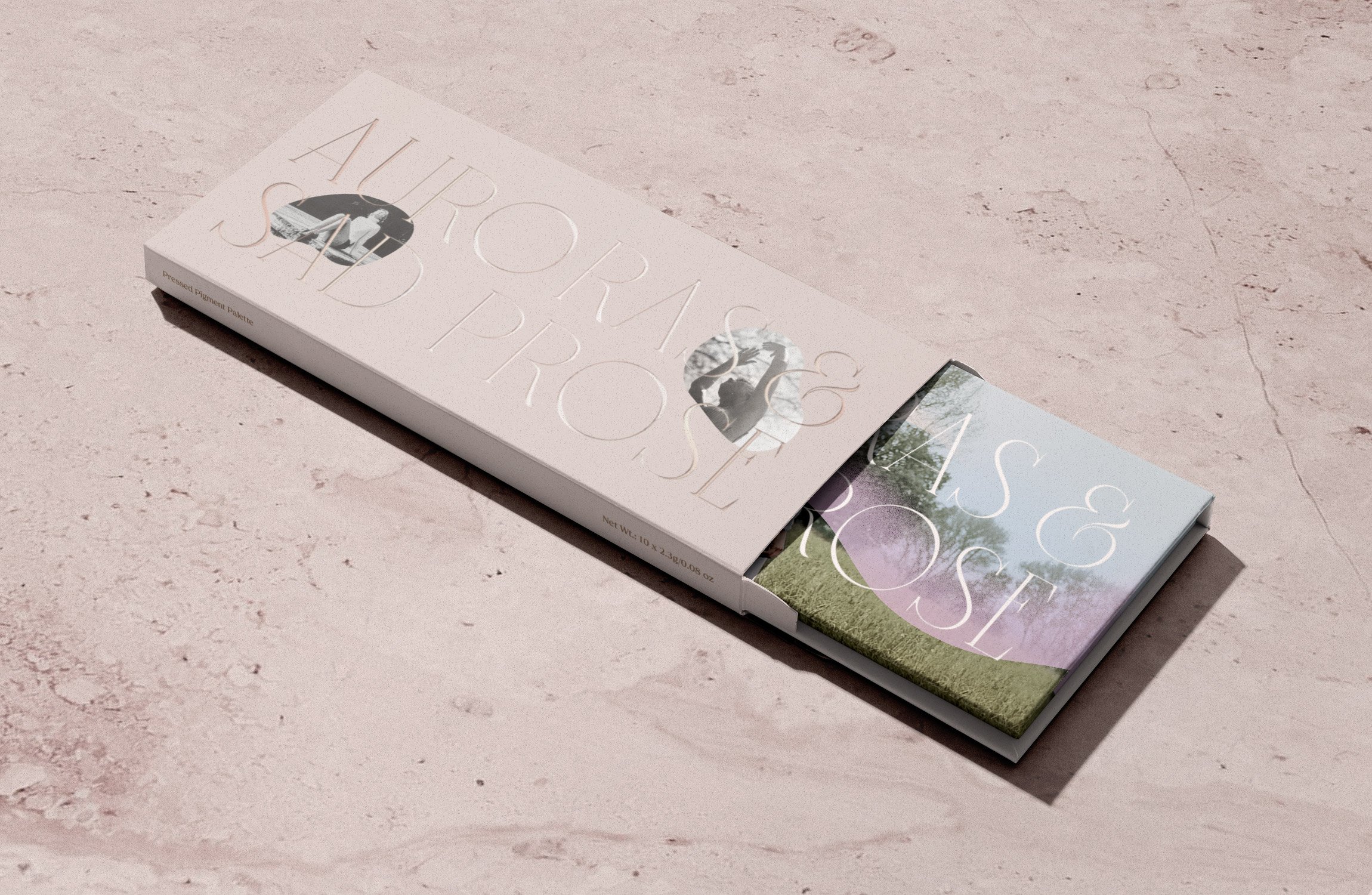 A pink box set titled "Hair & Makeup Shadow Palette" with photos of women on the covers, placed on a light pink marble surface.