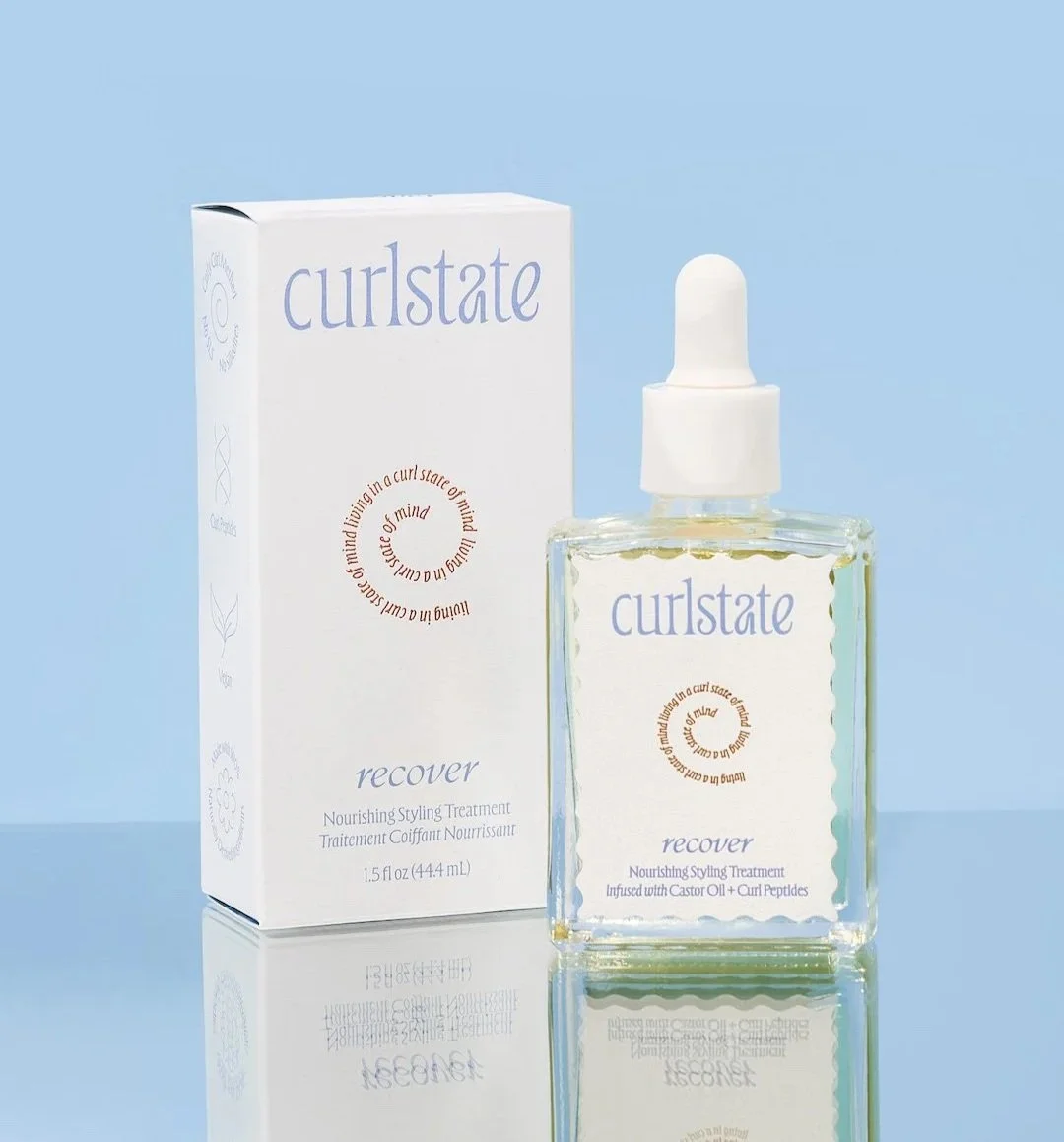 A skincare product named 'curlstate recover' in a clear glass bottle with a white dropper, placed next to its white packaging box, against a light blue background.