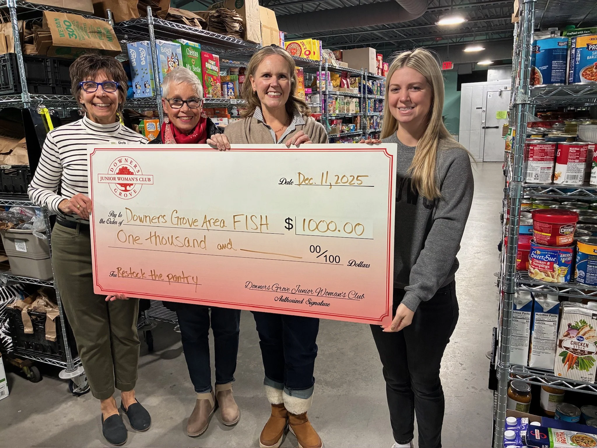  Presenting FISH with a $1,000 check 