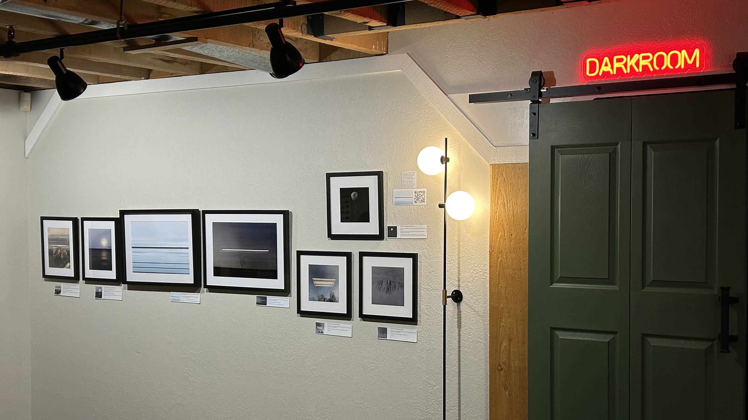 A photograph of the "Small Works" show by Jeffery Oliver at Lenses & Brushes in Boise shot by J. Lynn