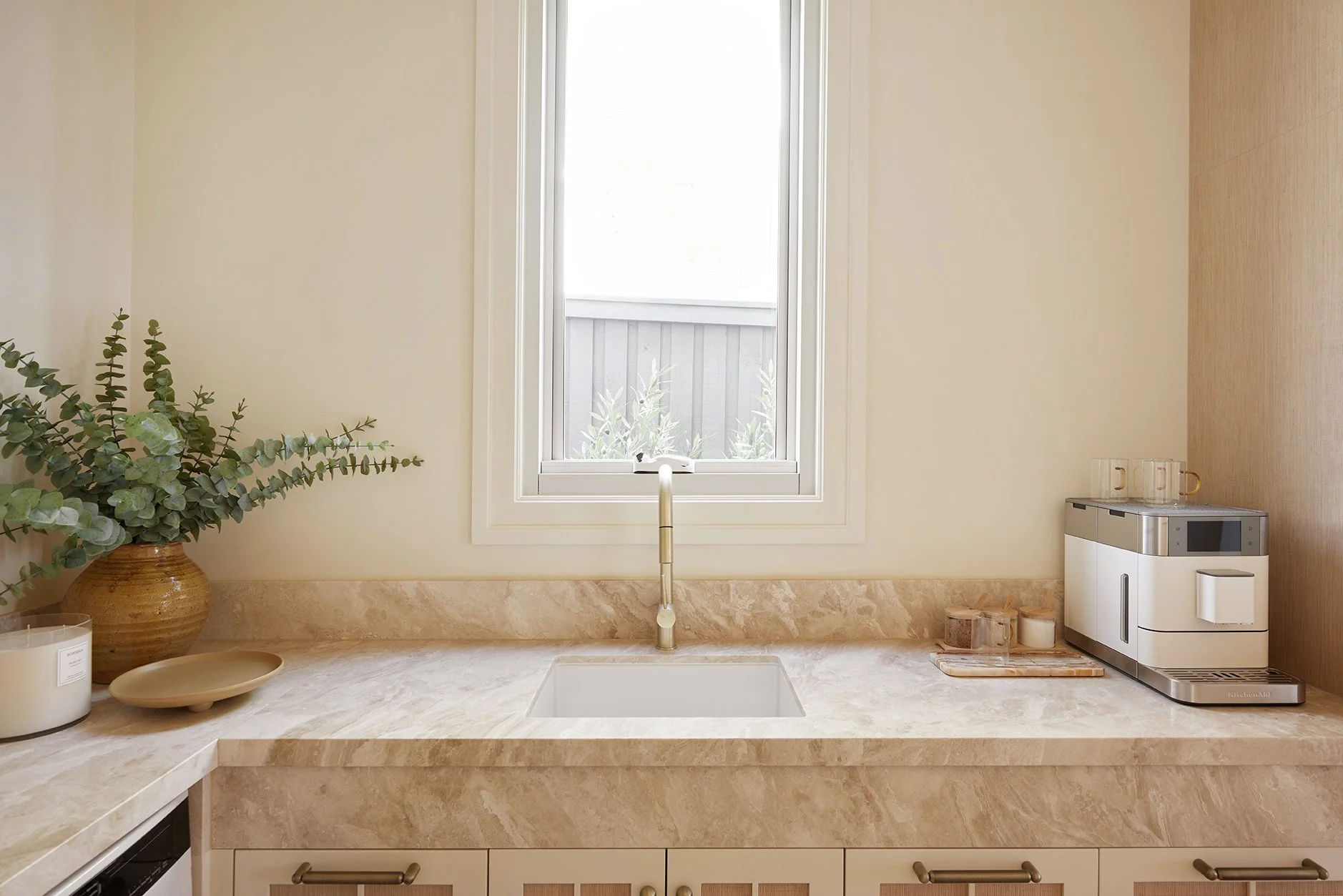Three Birds Renovations House 17 kitchen with marble benchtop, brass tapware, integrated sink and warm neutral styling.