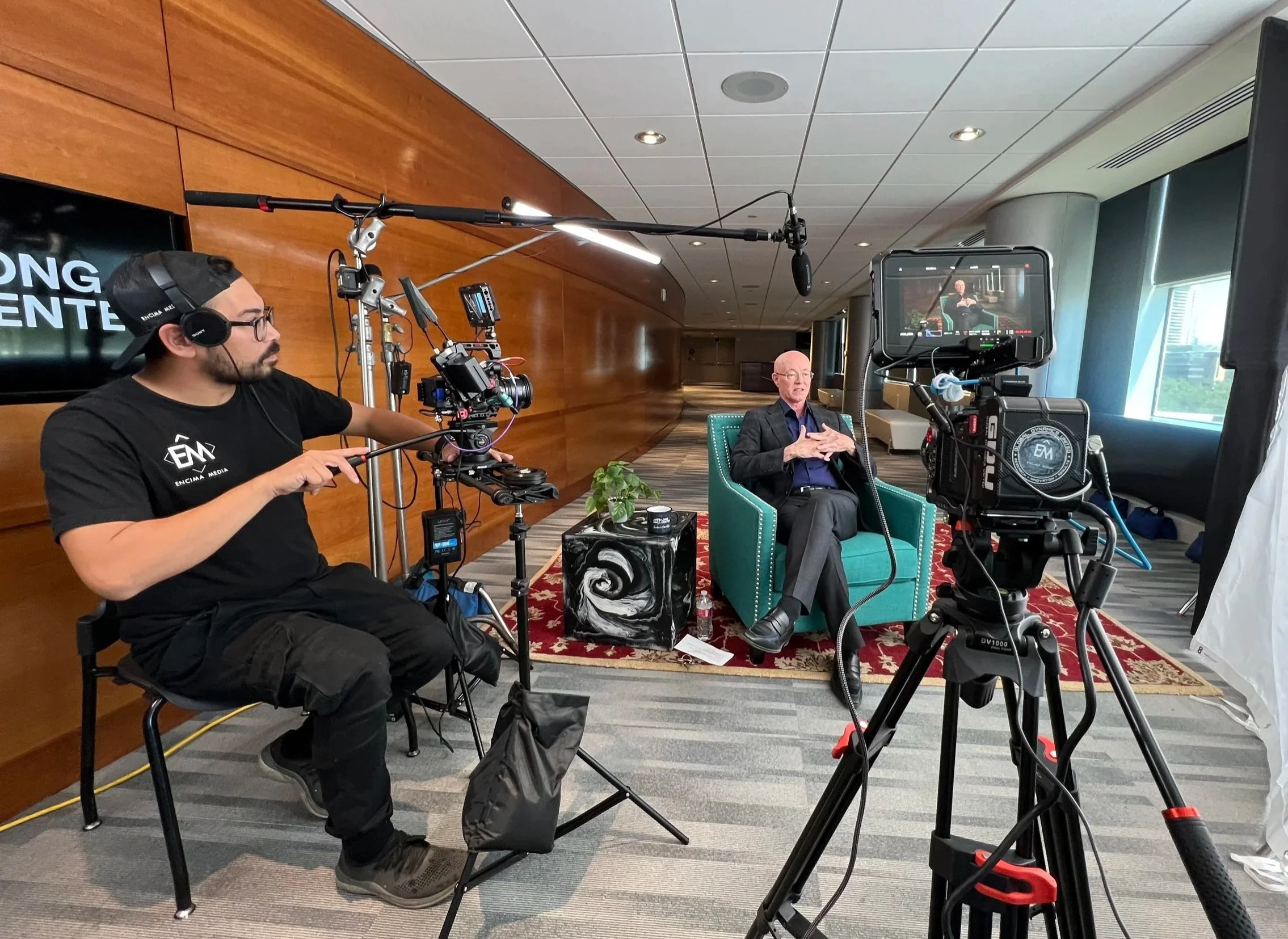 Video production crew conducting a professional sit down interview for a corporate commercial production.