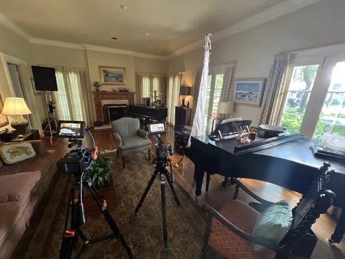 Interview setup with cameras and lighting inside a home for the 1913 Mercer commercial production.