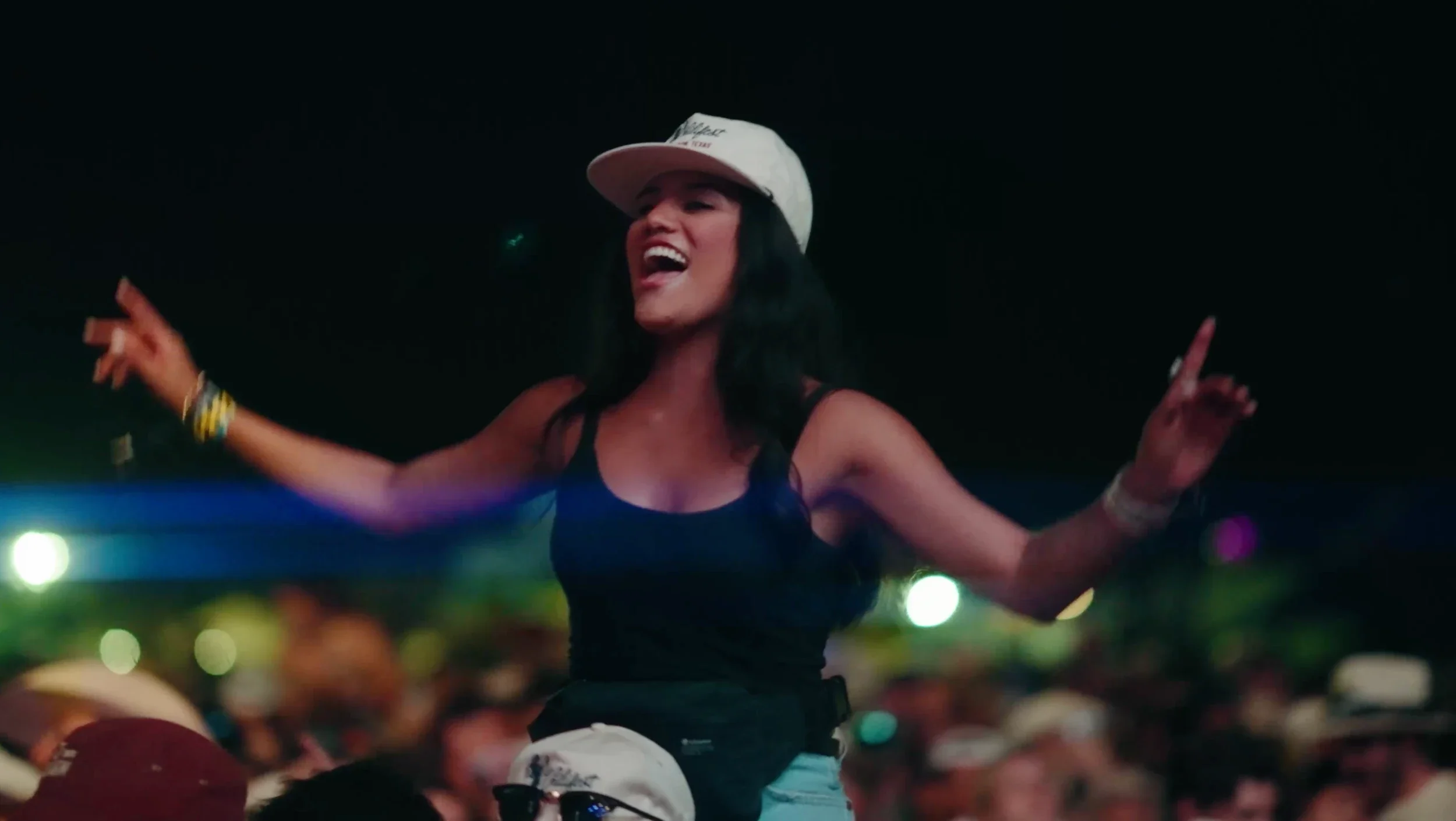 Fan being lifted by another crowd member at the Chili Music Festival.