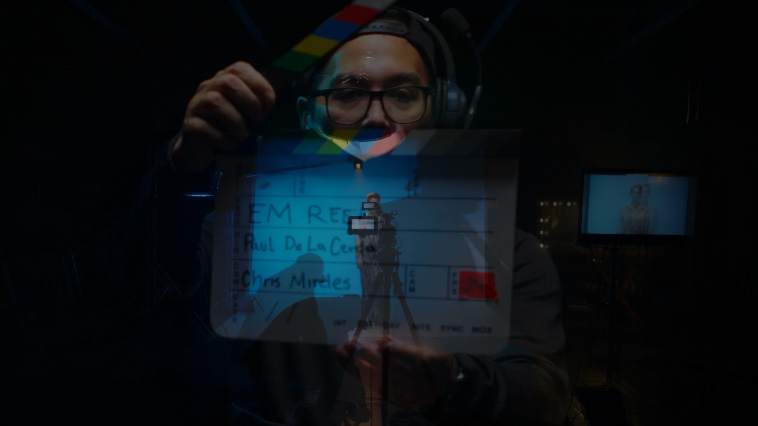 Encima Media crew member using a clapboard, representing high-quality filmmaking and storytelling.