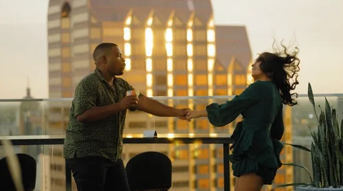 Couple dancing at the top floor of Thompson Hotels.