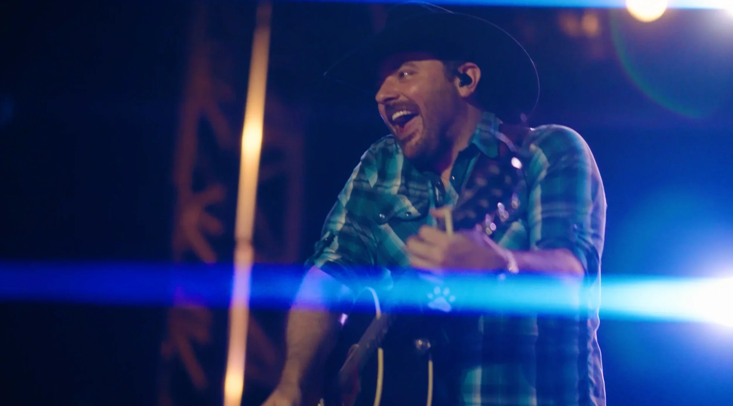 Artist performing on the main stage under professional lighting during the Chili Fest concert.