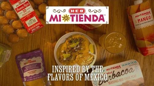 Family meal featuring H-E-B Mi Tienda ingredients on a wooden table.