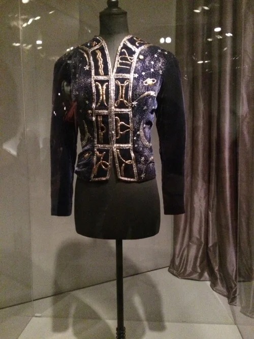 Seen above is a blue velvet ‘celestial’ evening jacket by Elsa Schiaparelli from circa 1920 finished with a combination of matte and sheen to resemble ‘stardust’; twelve zodiac signs embroidered using gold thread and rhinestones to represent comets and shooting stars. Even in today’s fashion, iconography is often used to express a designer’s personal interest. An example is Jeremy Scott’s usage of cartoon characters in his designs to express his playfulness.