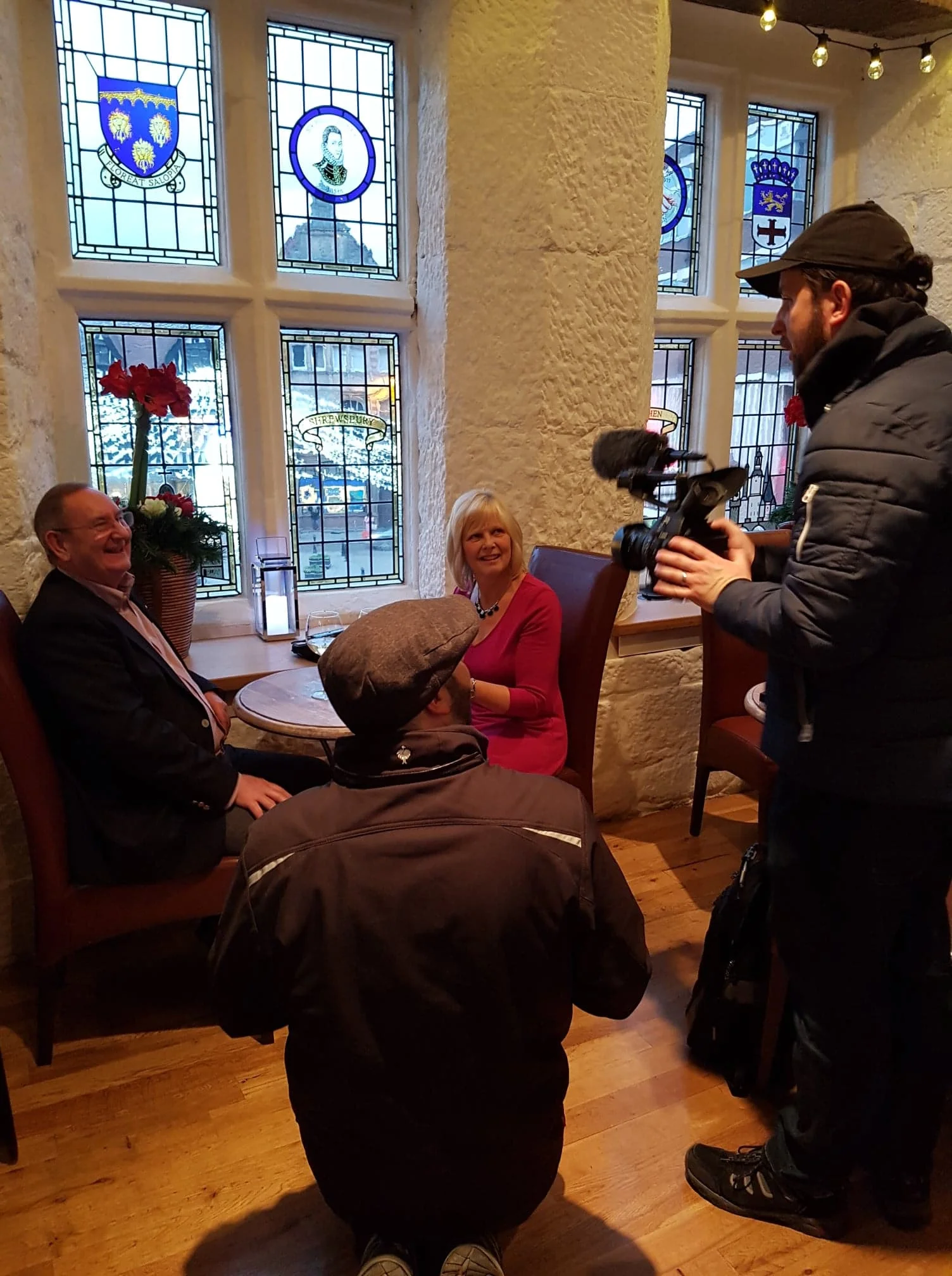  Filming of couple sat at a table in the Old Market Hall in Shrewsbury. 