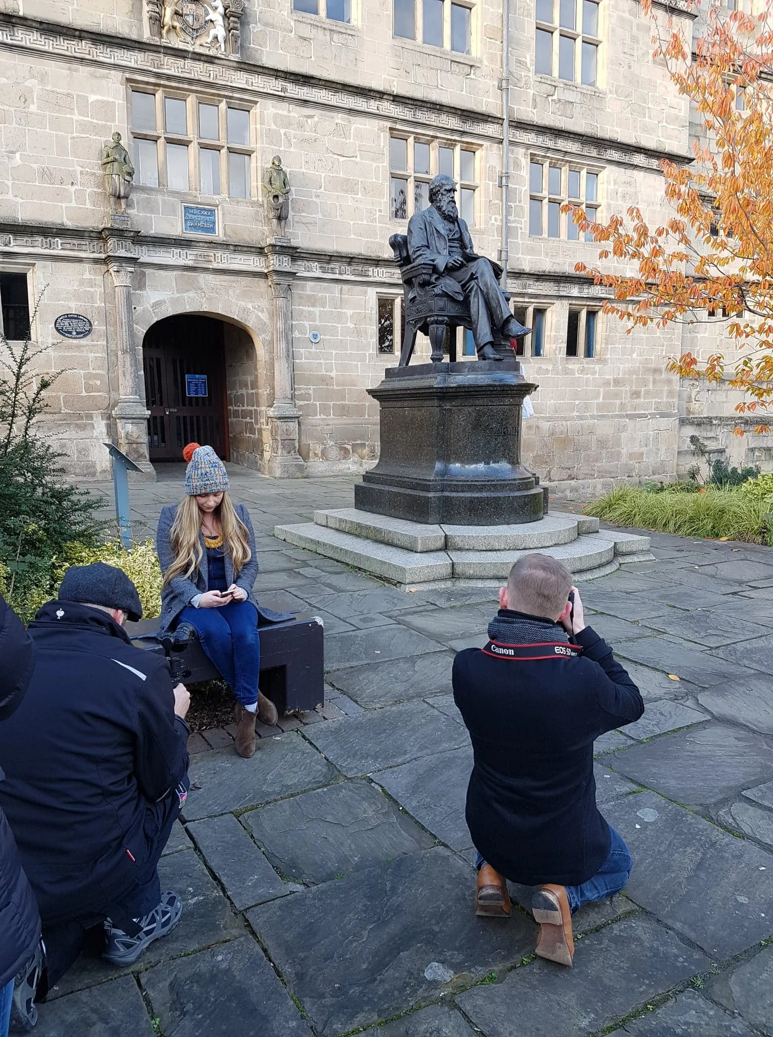  Photographer Richard Wilkinson photographing woman by the Darwin statue in Shrewsbury. 