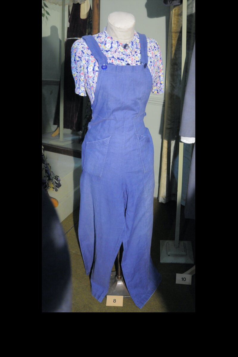 c. 1940 “Dig for Victory” cotton dungarees over a printed rayon blouse