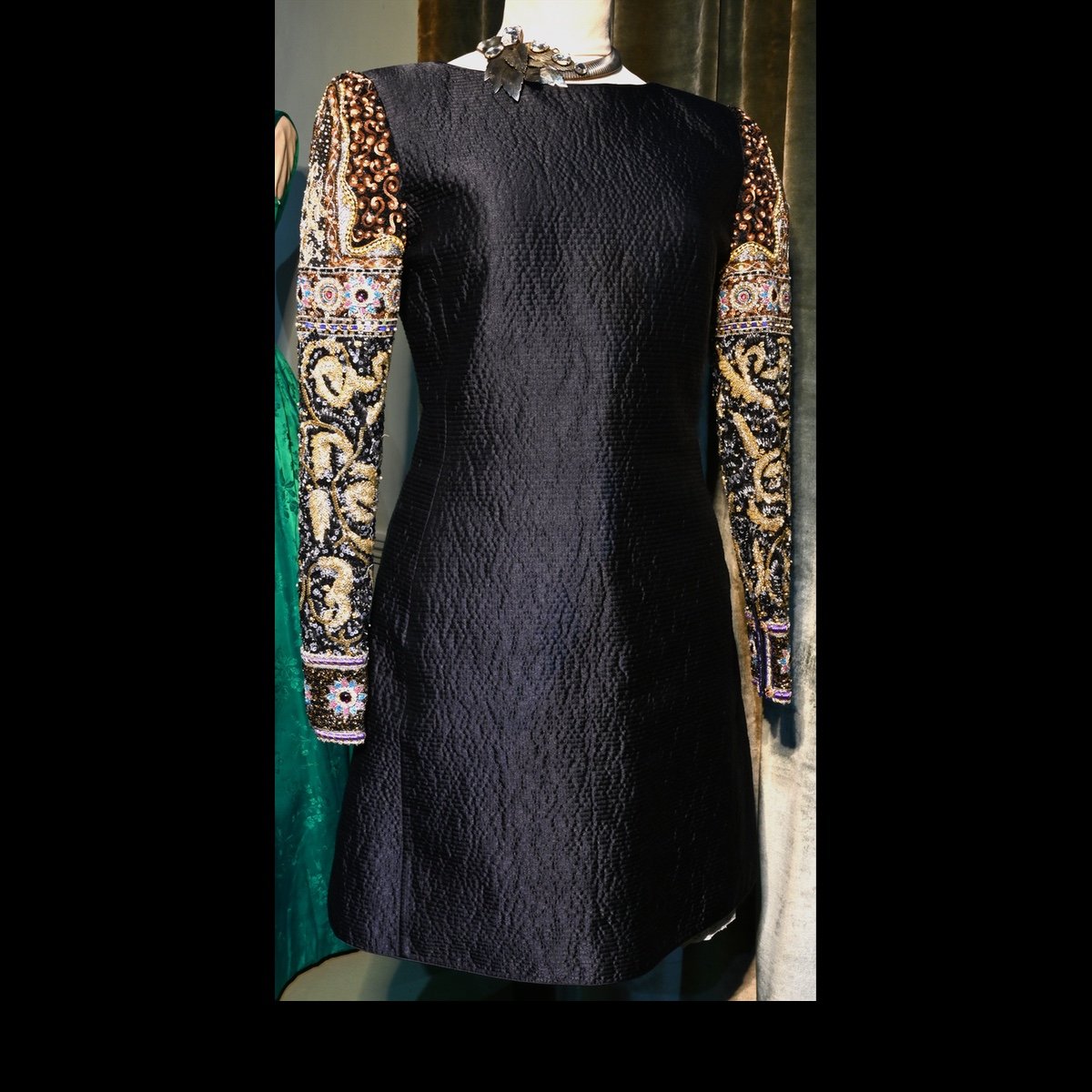 c.1980 Black cocktail dress with beaded and sequinned sleeves