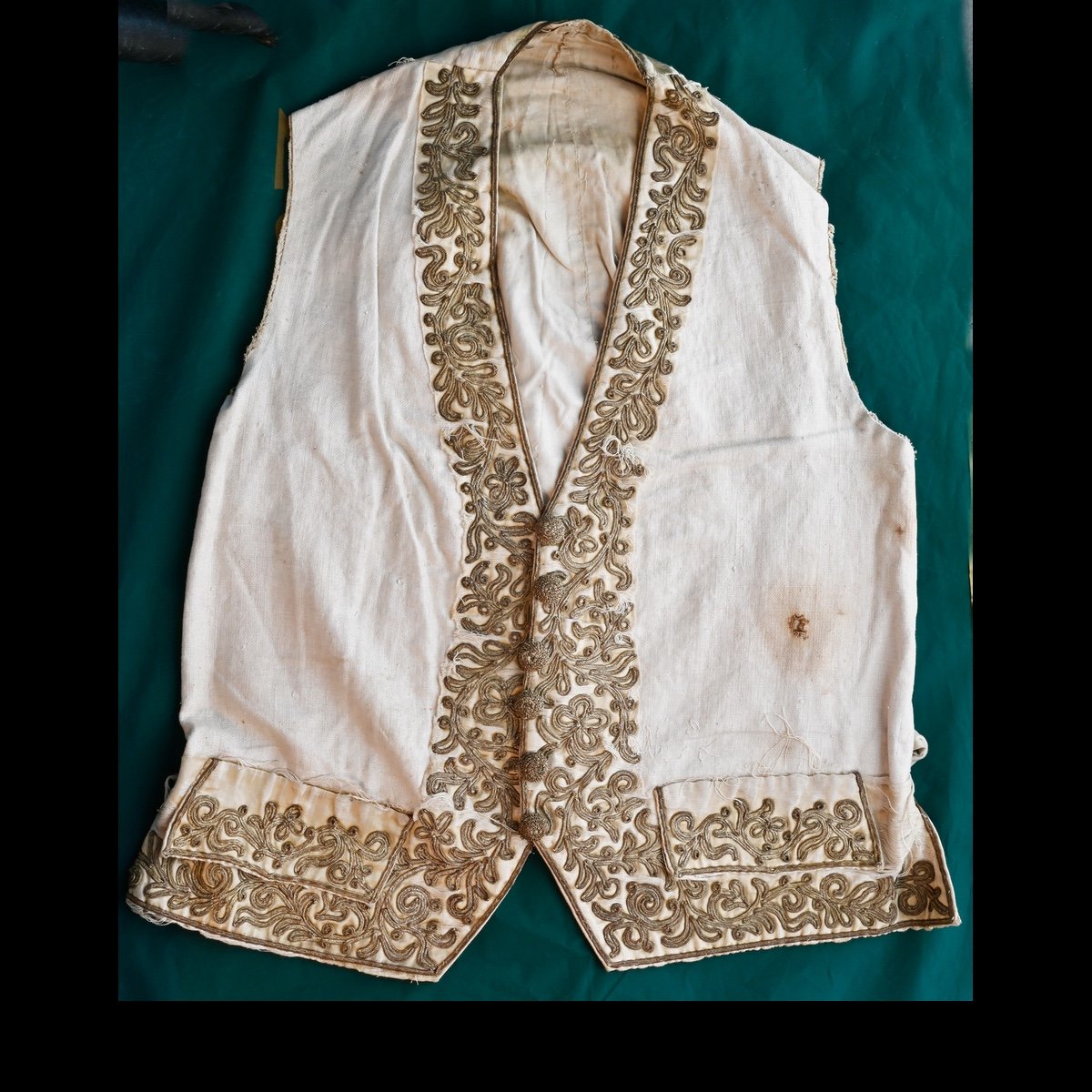 Remains of late 18th century cream shot silk waistcoat with metallic embroidery