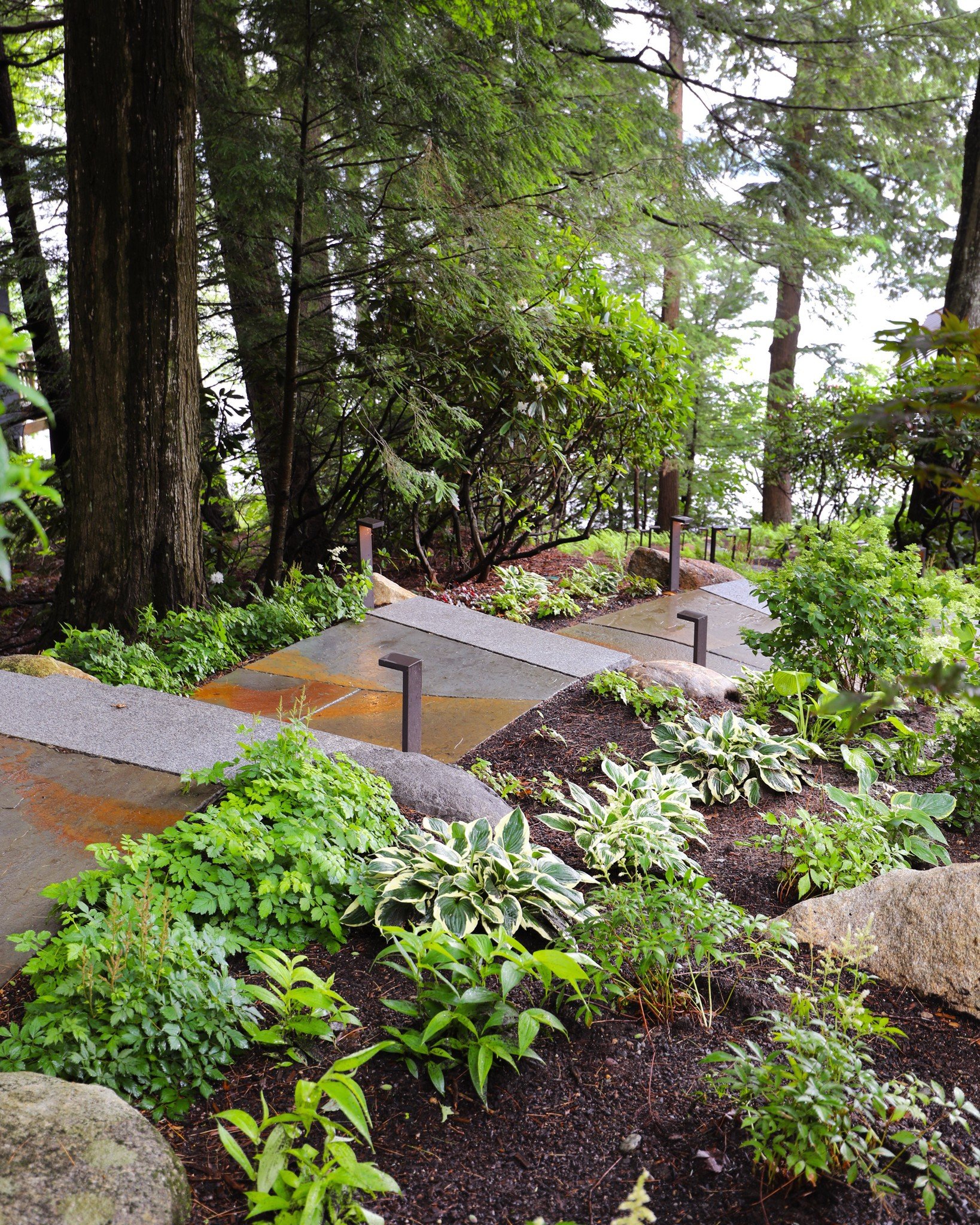 Create a seamless transition throughout your garden with Goshen landings and granite steps. The smooth, thermal finish of granite complements the earthy texture of Goshen stone, giving your outdoor space a refined yet natural feel.

#HardscapeDesign 