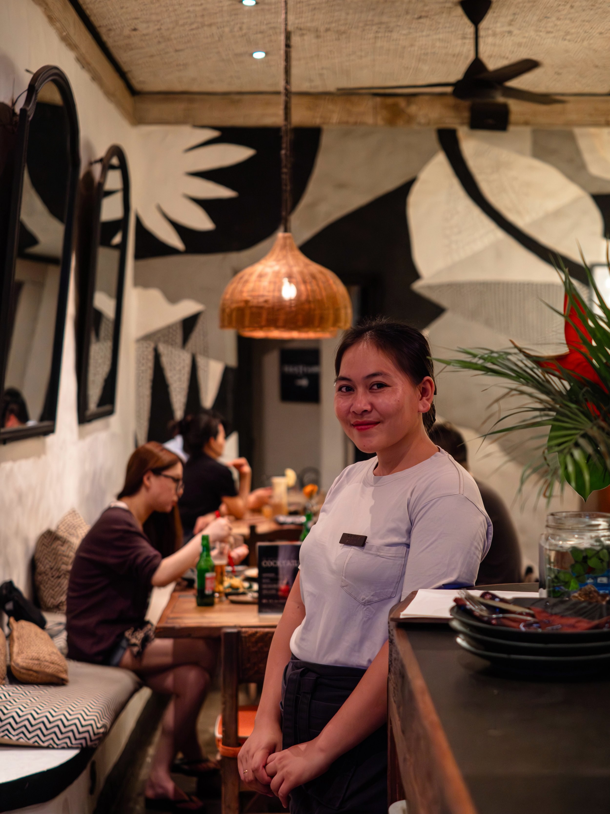 A warm welcome, a table full of Indonesian favorites, and the aroma of live-fire cooking in the air. Meet Komang, one of the friendly faces behind the smiles, stories, and memorable dining experiences we love sharing every day. Pull up a seat, enjoy 