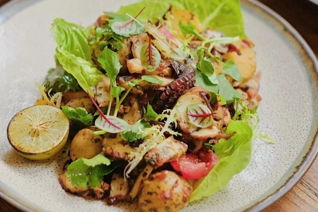 fresh vegetables with grilled octopus and lemon