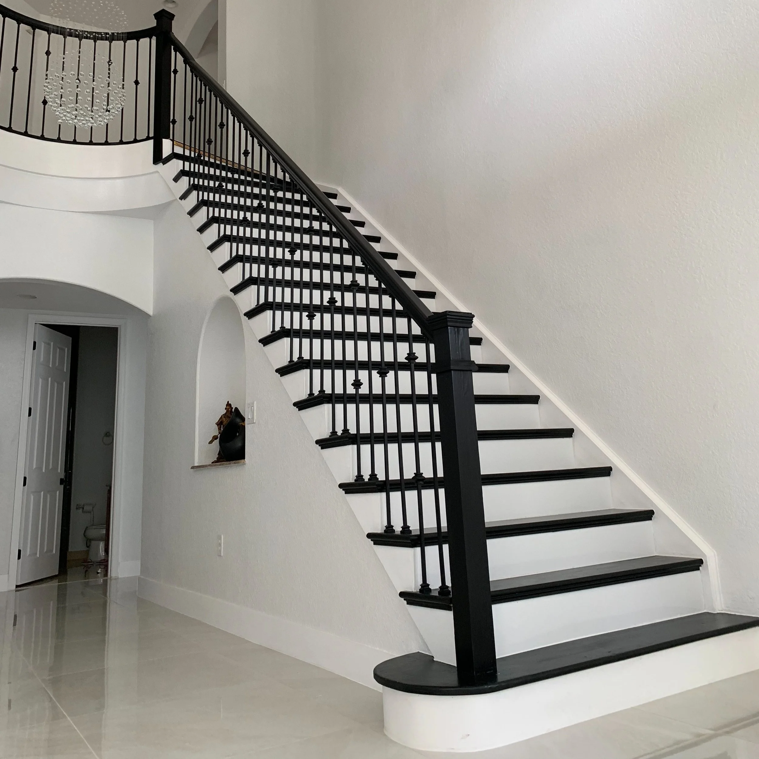 Tile (36"x36"), Stair Remodel (railing, newels, cut stringer, spindles, treads, wrap around cove molding, risers, staining &amp; painting), Baseboards &amp; Painting.