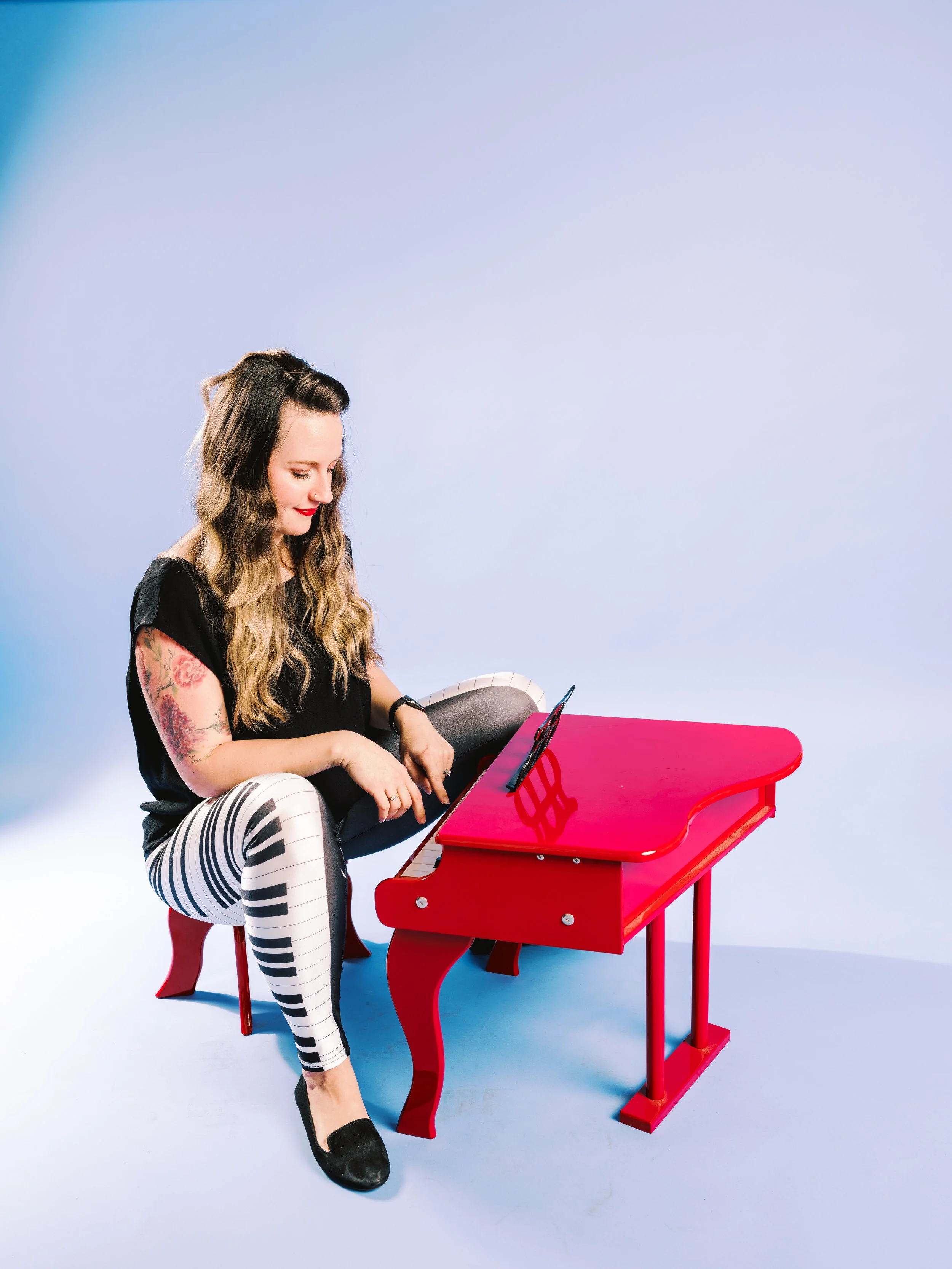 Jacy at red piano.jpeg