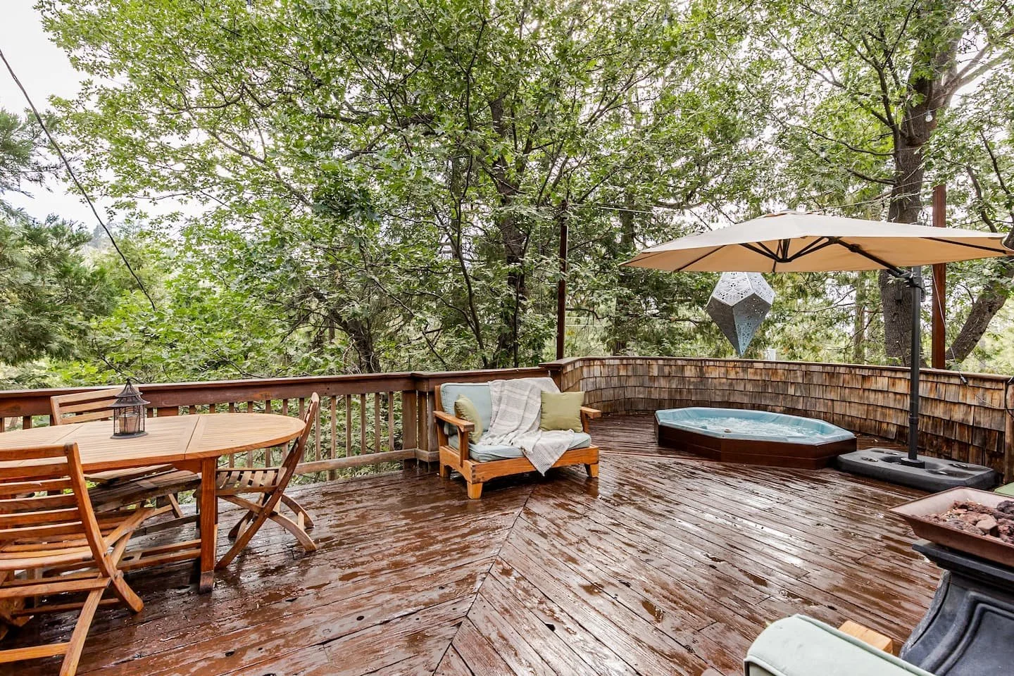 Long outdoor dining table for large groups on the deck at Faerie House Idyllwild