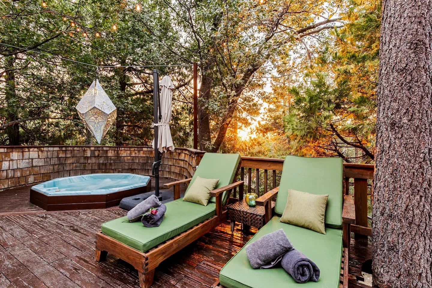 Hot tub and chaise lounges on the private deck at Faerie House Idyllwild