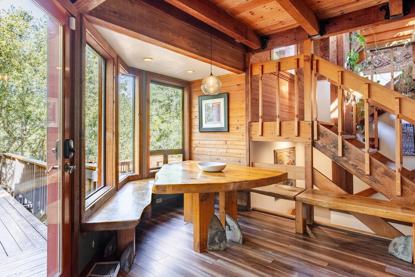 Evening lounge glowing by the fireplace with layered textures and soft lighting at Faerie House Idyllwild