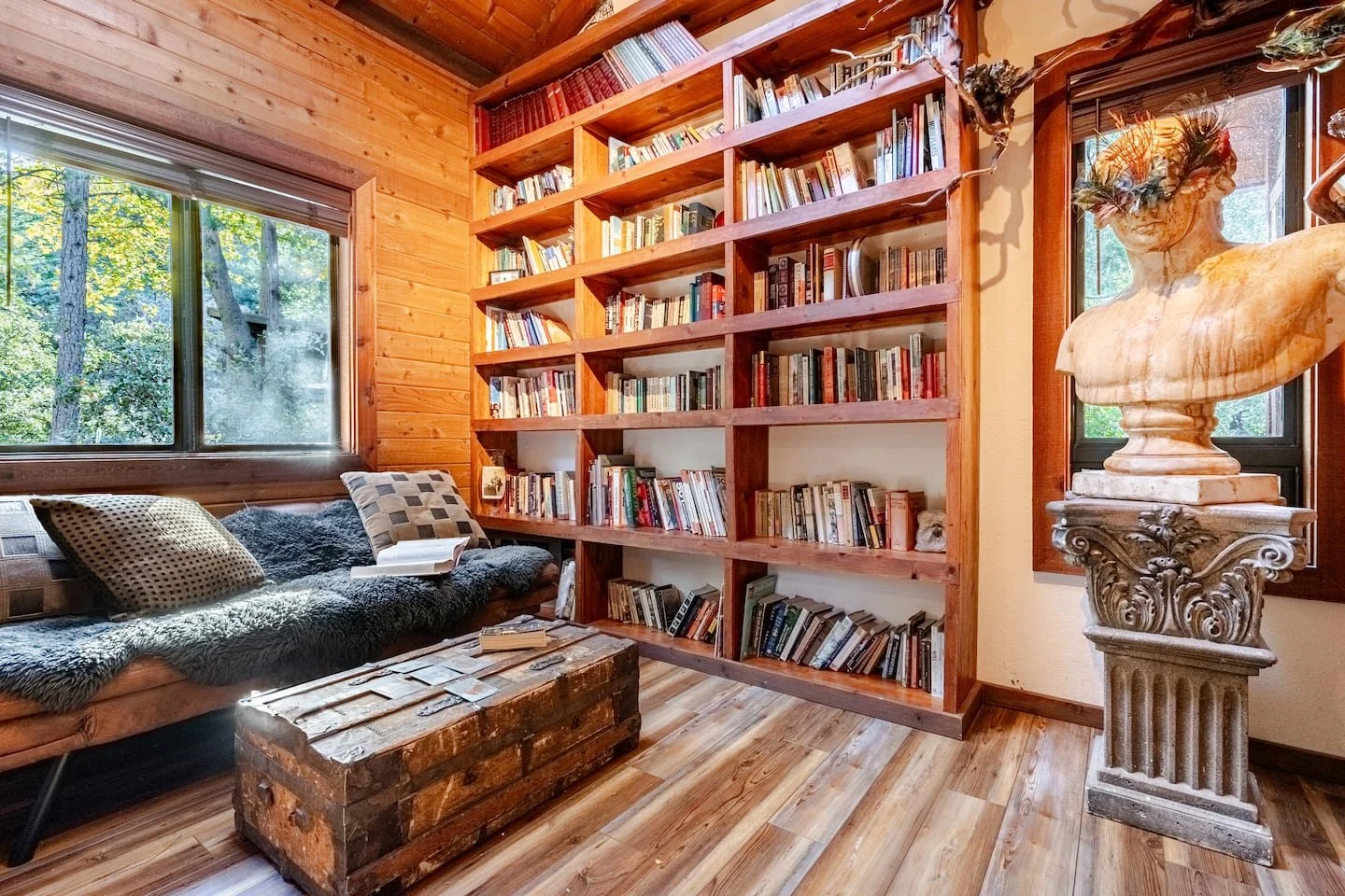 Cozy reading nook with warm lamplight for book lovers at Faerie House Idyllwild retreat cabin