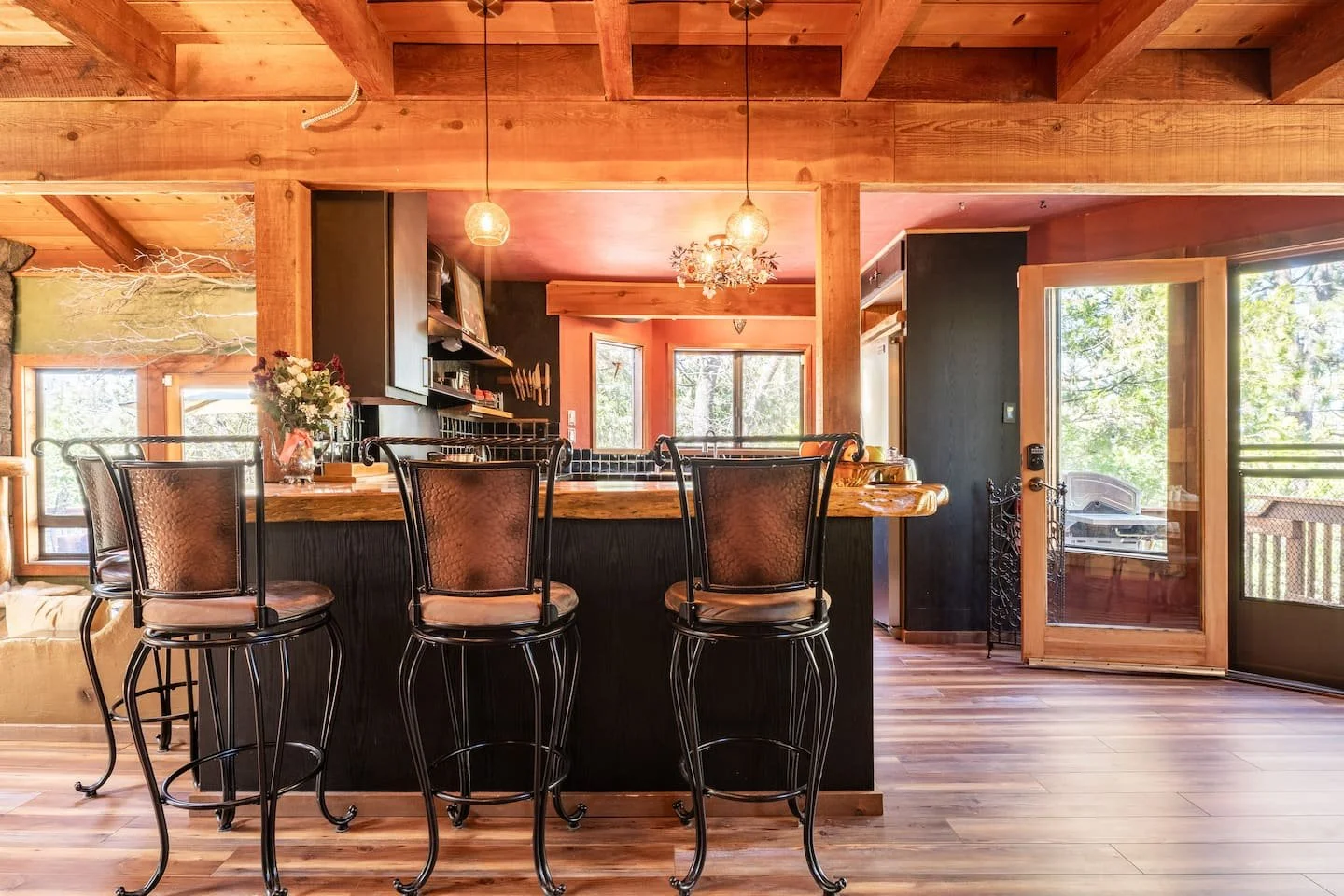 Open-concept kitchen with rustic luxury finishes at Faerie House Idyllwild cabin rental