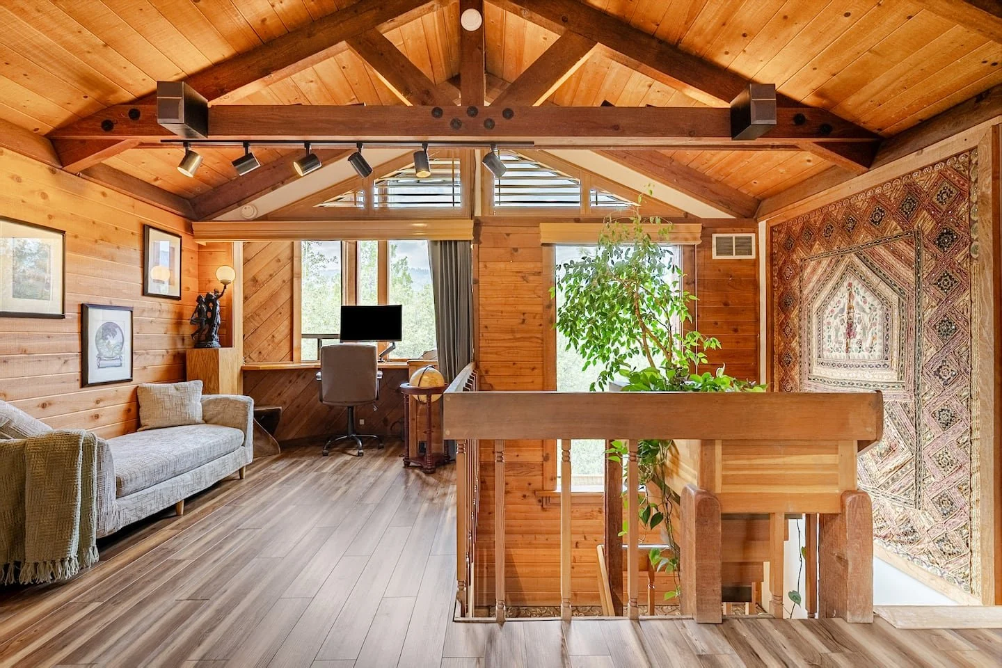 Quiet forest-view lounge with natural light, ideal for remote work retreats at Faerie House Idyllwild