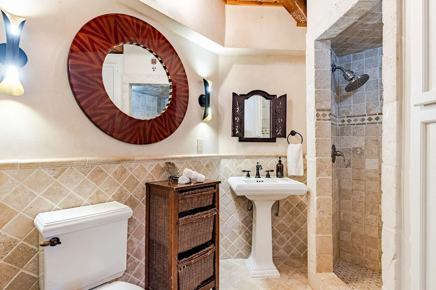 Spa-style bathroom with natural stone finishes at Faerie House Idyllwild mountain cabin