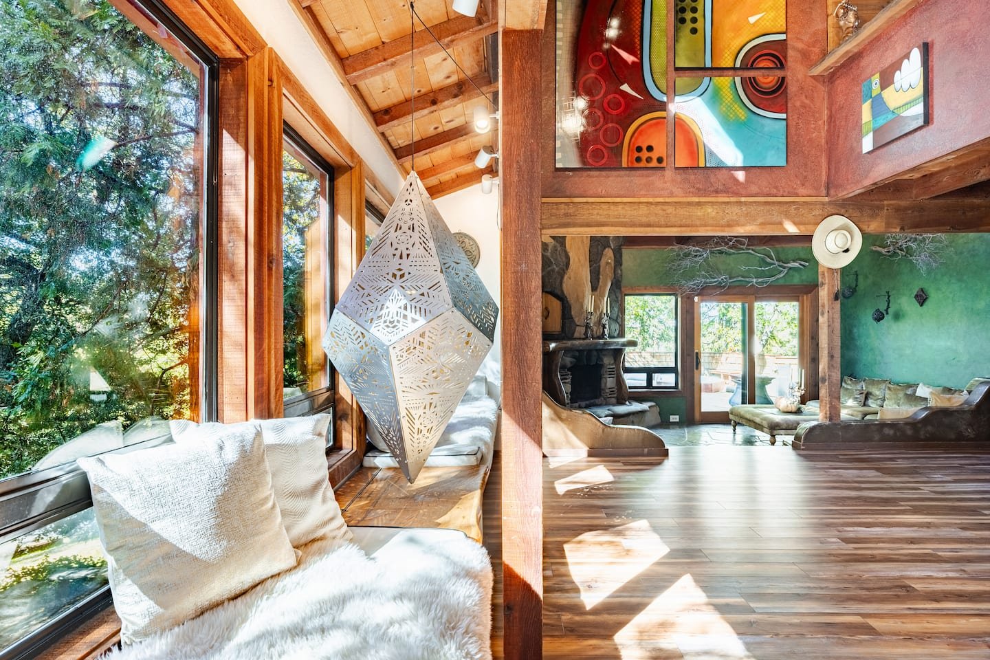 faerie-house-idyllwild-great-room-forest-window-walls.jpeg