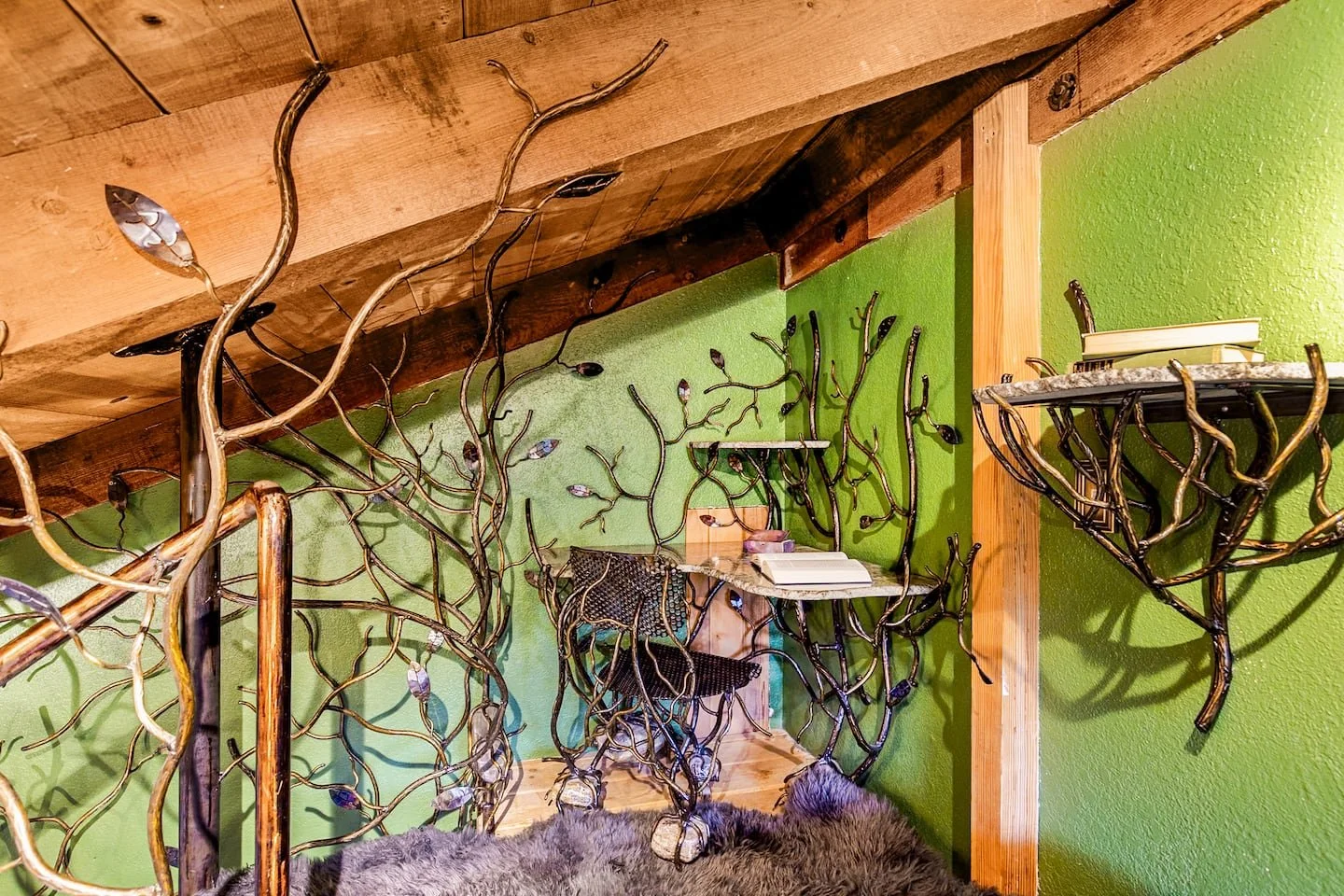 Custom iron and granite desk in the treehouse loft bedroom at Faerie House Idyllwild