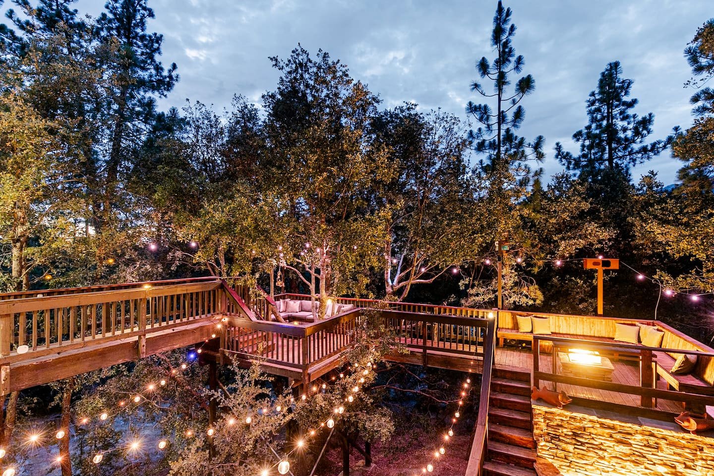 Golden hour light over the outdoor dining deck at Faerie House Idyllwild