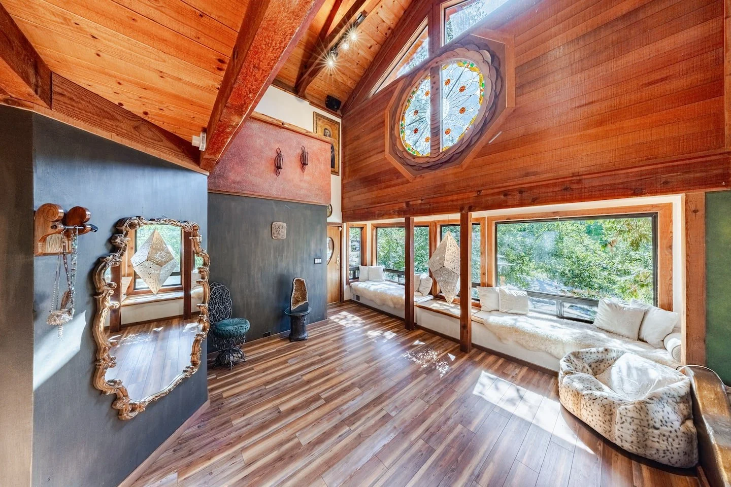 Open great room under the cathedral atrium with seating for large groups at Faerie House Idyllwild
