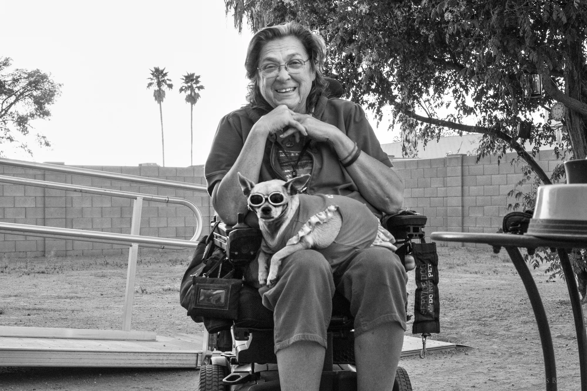 Kirstin Marie Cender, Private First Class, Military Police, and her service dog, Shirlie.