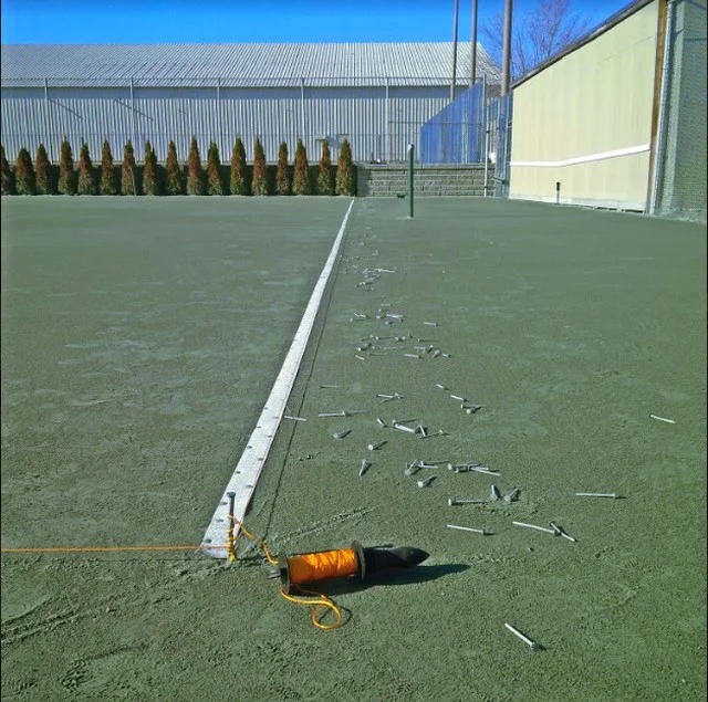 A clay tennis court requires up to 13 lbs of aluminum nails-  that's over 2,000 nails per court.  Here's a photo from our crew right before nailing new lines down at Richmond Hill Country Club. #tennis #job #nails
