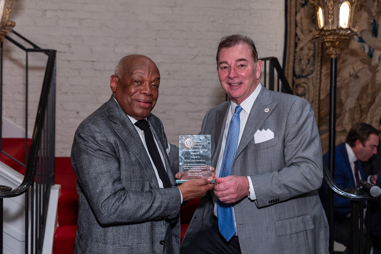 Mayor Willie Brown receiving the Transatlantic Bridge Award from CAC President Marc Corsi