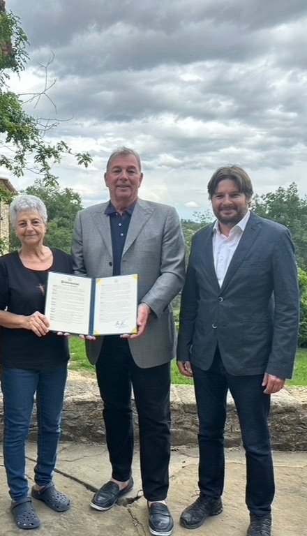 CAC President Marc Corsi and CAC Vice President Anselm Bossacoma present family members of Supercentenarian Maria Branyas with a resolution from the San Francisco City Board of Supervisors