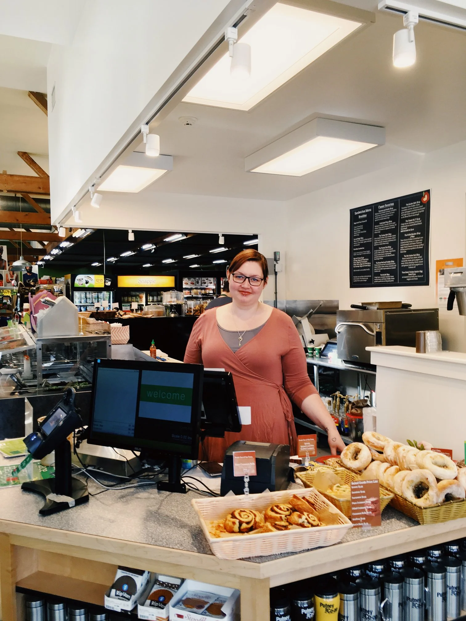 Staff and Board member Yitz mans our new Deli register