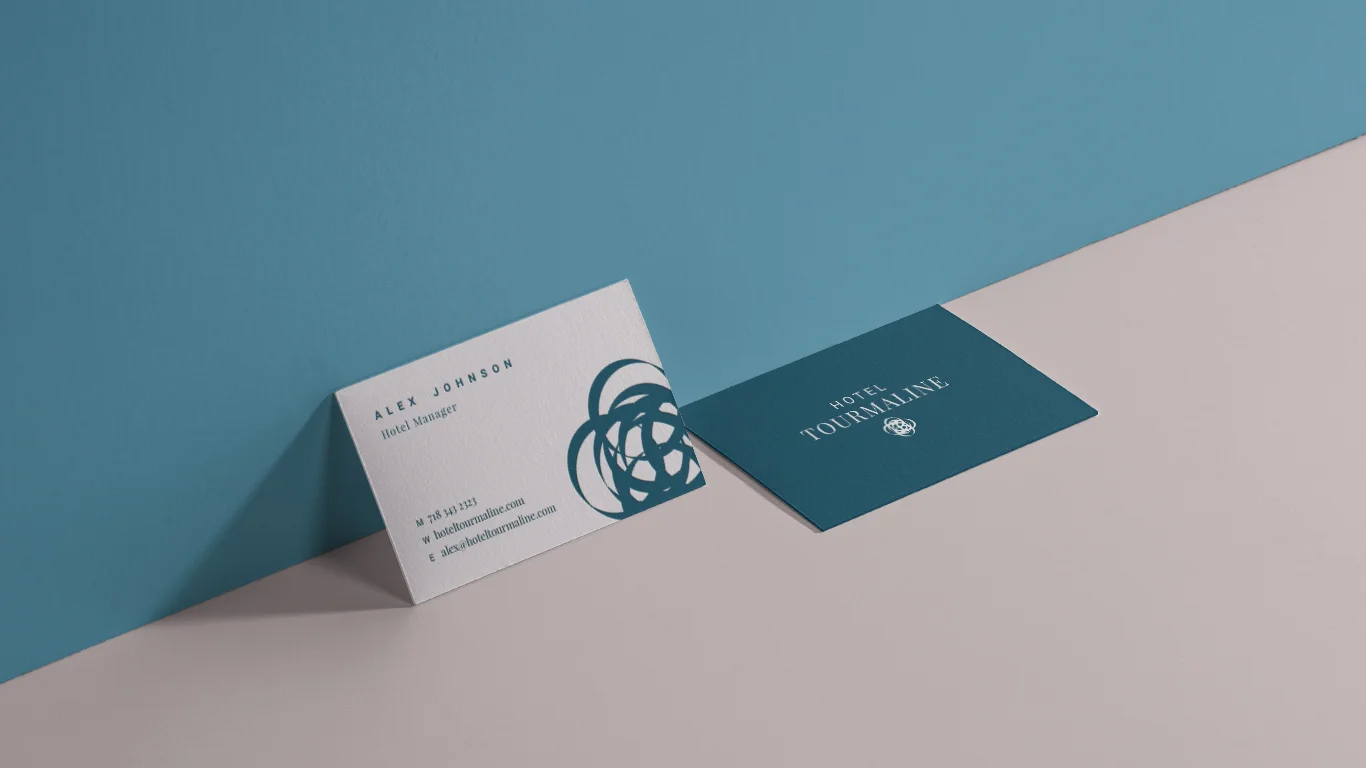 HT 2 Biz Card Against Wall.jpg