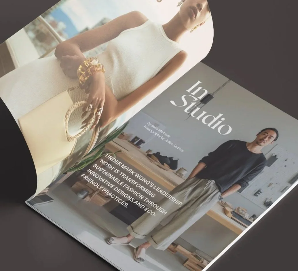A magazine page featuring a woman in a white sleeveless dress and a man in casual clothing in a modern, bright interior space, with text discussing sustainable fashion and innovative eco-friendly designs.
