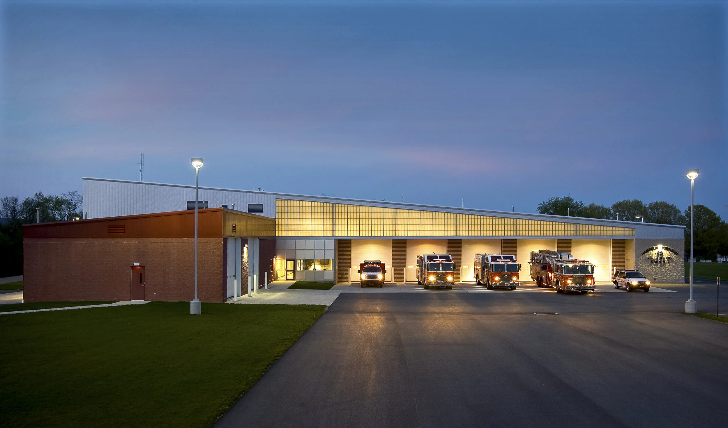 Buchart Horn Architect's work with Hampden Township on this project was organized in three phases. The second phase is the construction of a new Emergency Services Building (ESB North). Designed to replace the 50-year-old Good Hope Fire Station, the $4.5-million ESB North provides improved fire and ambulance services to the Township's rapidly growing northern sections as well as to accidents on nearby I-81. The new one-story facility includes five drive-through fire equipment bays, an EMS section, a public multi-purpose room with a kitchen, an emergency operations center, dormitory rooms, a fitness area, and space to store and display historic fire company artifacts. Building placement on the site and vehicular circulation were carefully considered. Both the site and the new building were zoned to separate public and emergency circulation and functions. The building is partitioned into discrete Medic, Fire and Public areas, and arranged based on their relationships to one other and the need for efficient site circulation. The form of the 25,000-SF building is shaped by the needs and relationship of the building's functions as well as a desire to create a simple but memorable landmark for this area of the Township.