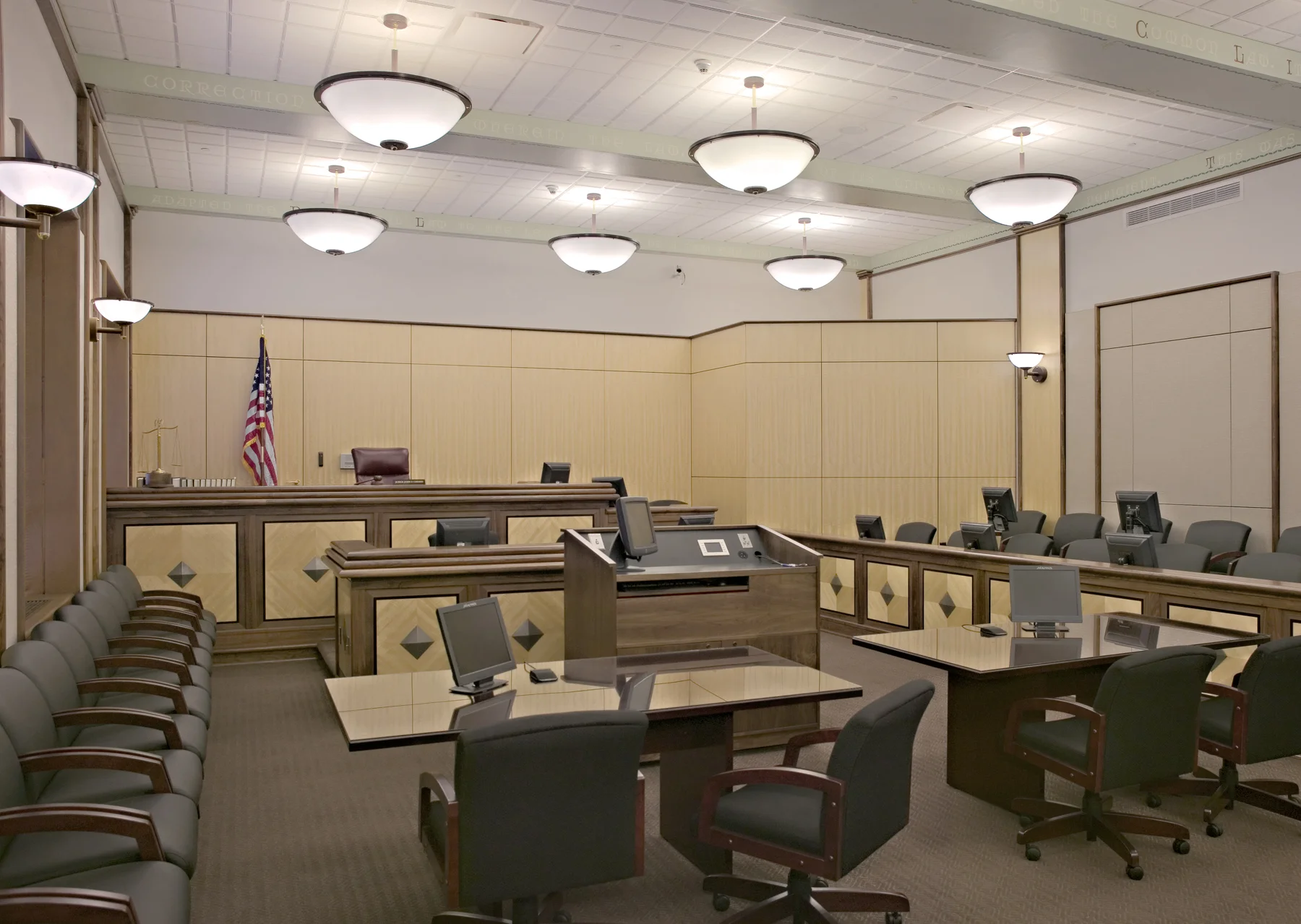 The County Commissioners, the President Judge, and Buchart Horn Architects, through extensive planning and consensus building, determined the short-term and future needs for the Dauphin County Courthouse. The courthouse is prominently located in the downtown business district of Harrisburg and within walking distance of the State Capitol. Erected in 1941, the six-story, 140,000 SF marble landmark is recognized on the National Register of Historic Places. In order to maintain all courtrooms on the third and fifth floors, the fourth floor being jury deliberation and upper portions of courtrooms on the third level, the new courtroom displaces the law library on the fifth floor. Great care was taken to maintain all artifacts and incorporate them into the new courtroom, while assuring proper traffic flows, courtroom technology, and courtroom security. The renovation program was phased and the building was occupied and functioning during construction. The design included a new state of the art courtroom; Judges' chamber suites; relocation of the law library to include electronic retrieval systems; and relocation and expansion of jury assembly to accommodate a larger juror pool. Also included were two new 5,000 lb. elevators to accommodate secure juror movement. The new elevators can be controlled to coordinate with the existing passenger elevators or be taken off line to provide secure passage of the jurors to the appropriate levels of the courthouse. Courthouse security and upgrades in both new and existing areas were phased with the construction. New and replacement infrastructure assemblies were accomplished in a phased construction process. All affected areas were brought up to ADA standards.