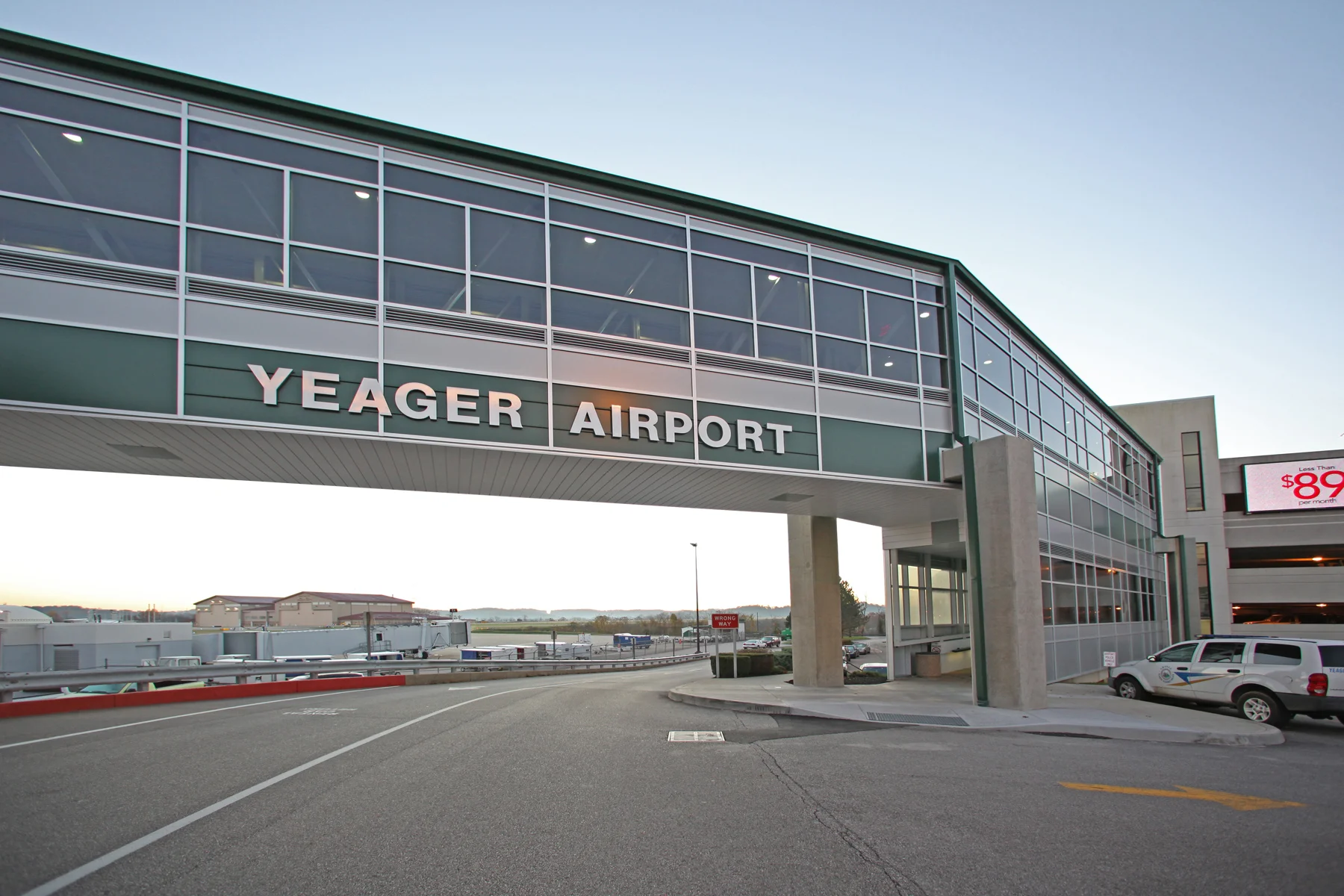 A total of $4.7 million worth of stimulus funds were allocated to Charleston's Yeager Airport for terminal building improvements including: Pedestrian Bridge and Elevator - New pedestrian bridge providing a weather safe connector between the long-term parking garage and the Terminal Building. Also included reconfiguration of the short-term outdoor parking area. Terminal Canopy Upgrade - Replacement/upgrade of existing roof canopies at the Terminal Building front, including addition of blast protection measures, replacement of front sidewalks, and addition of LED programmable signage. Baggage Carousel and Tunnel - Refurbishment of the existing baggage carousel, as well as installation of weather enclosures on the apron side to address updated energy code requirements. This task also featured waterproofing of both existing baggage handling tunnels and design of an air curtain system to reduce the loss of tempered air. Floor Improvements - New floor finishes were specified for high traffic areas. Restrooms - Renovation of main lobby rest rooms including new sinks and counter tops, new wall tile, new ceiling tile and lighting, and improvements to existing ventilation. Fire Suppression - Previously completed plans for upgrades to the fire suppression system were incorporated in to the bid package. Security System Upgrades - New security cameras were added to the existing backbone. Funding requirements for this project dictated an extremely short design schedule of approximately six weeks from the date of our selection until completion of project bidding documents. 