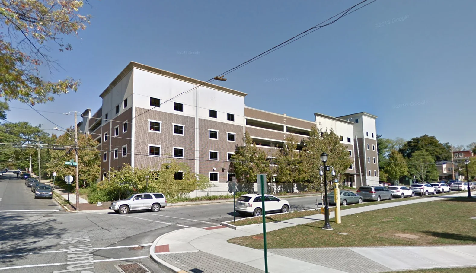 Buchart Horn Architects, in association with the Harman Group, designed two multi-level parking structures for the Borough of West Chester. The structures totaled approximately 130,000 SF of floor area with parking for 1,000 vehicles. Sharpless Street Parking Structure. Located at the northeast corner of Sharpless and Church Streets in the Borough of West Chester, this is a precast, five-level, 500-car parking structure built for West Chester University. Its context is transitional between the University and the residential community. Its architecture reflects the traditional row-house design of the town and uses inlaid brick and granite wall panels and spandrels.