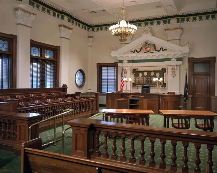 The Somerset County Courthouse, built in 1906, needed a renovation to meet modern fire safety and handicapped accessibility codes and to add a third courtroom. As the county had recently constructed a new building to house many offices, a new interior configuration was developed that replaced the former Recorder of Deeds office, the former commissioners offices, and other spaces, with a third courtroom. Insertion of the new courtroom in the building had to be carefully designed to meet technology requirements, and to maintain and respect the building’s landmark status. Major systems in the building were completely redesigned including HVAC, electrical, fire protection, and plumbing. Interior surfaces were restored, including the Italian marble, rotunda and monumental stair, while historic light fixtures were refurbished with new wiring and finishes. All courtrooms were restored and now incorporate modern technology for the presentation of evidence. The existing rooms required restoration of finishes and introduction of new code compliant architecture and systems. The renovated Courthouse Building contains the following offices: Clerk of Courts; Register of Wills & Clerk of Orphan’s Court; Prothonotary; Hearing Master; District Attorney; Law Library; Somerset County Courts; Court Administrator and Sheriff’s Office.