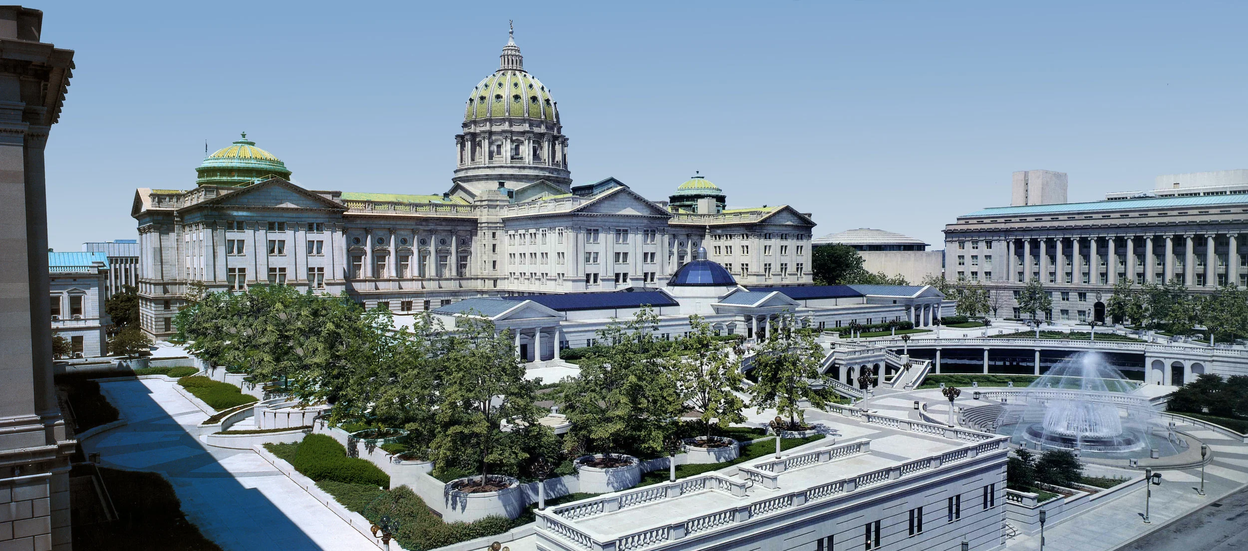 The main objective of the $140 million East Wing Addition project to the Pennsylvania State Capitol was to merge four existing National Landmark buildings into a complex serving more than 6,000 people. The merger was accomplished by building a 929,000 SF Legislative office Addition to the Capitol, connecting the four structures and 20,000 square feet of renovation and restoration of the existing building. Above the underground garage, the new addition to the main Capitol Building incorporates a 250,000 square foot plaza, an office/concourse level connecting all buildings, and an additional 300,000 gross square feet of office space for the State House of Representatives and the Senate. TV studios for the Senate and the House of Representatives which include broadcasting and taping facilities for individual messages to constituencies and group discussion were incorporated in the new addition. The Governor’s media room and press conference space has its own control room with satellite uplink and downlink as well as full TV broadcast capability. The Italian Renaissance Style of the addition was a must in order to preserve the historic fabric of the 1906 Italianate Capitol building, which is considered to be one of the finest of all the state capitals. The project was awarded the Arthur Ross Award by Classical America.