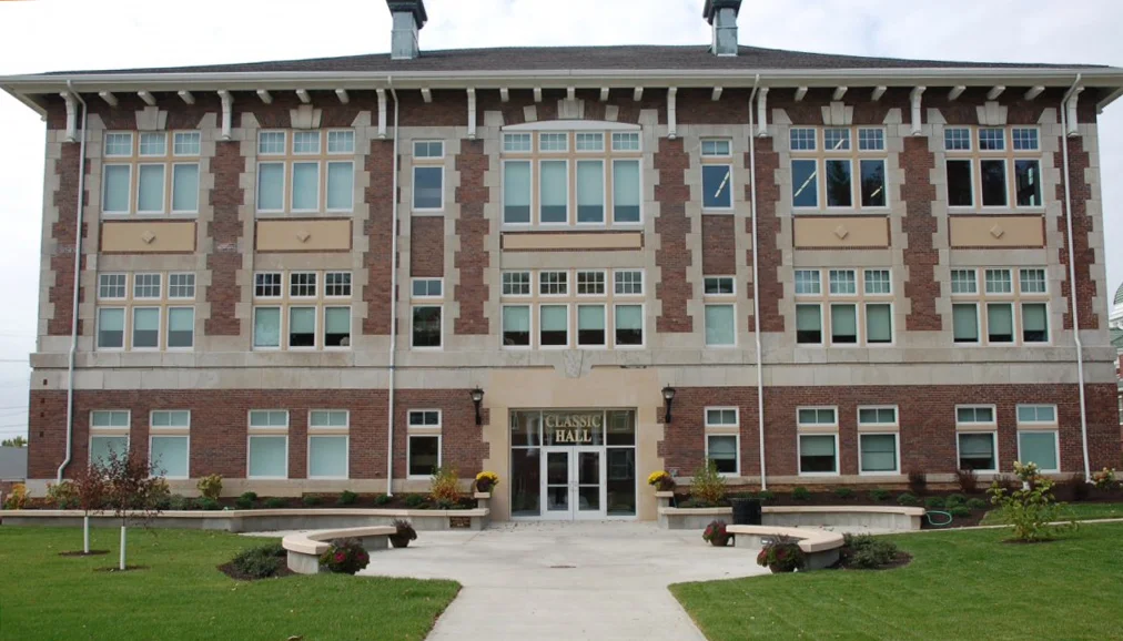 Central Methodist University has restored the exterior and renovated the interior of the historic Classic Hall for the 100 year anniversary. The 18,000 SF brick structure was built in 1911, and was occupied with many different programs over the years until 1980 when it was closed. The Renaissance Revival building is listed on the National Register of Historic Places. After Workshops with the College, BHA came up with a strategy to utilize the college’s space more efficiently by reorganizing spaces and developing their restoration. The expanding art and music departments are housed within the existing footprint. The Ashby-Hodge Gallery of American Art occupies the first floor with gallery spaces, a work room, and reception. The gallery storage is located in the double height space on the ground floor. The second floor contains the music department’s practice rooms, offices and a classroom. The third floor holds a band and choir room. The choir and band rooms feature the existing exposed trusses in the huge attic volume. These layouts are respectful of the numerous window opening and the existing structure. The detailed brick work has been restored to its original condition. All of the existing windows have been replaced with replicas of the original windows. The circulation has been redesigned to meet code and ADA requirements, including the addition of an elevator and the removal of a crude exterior ramp. The band alumni are already raising funds to name a lounge space on the second floor to honor the Central Bands 100 year anniversary.