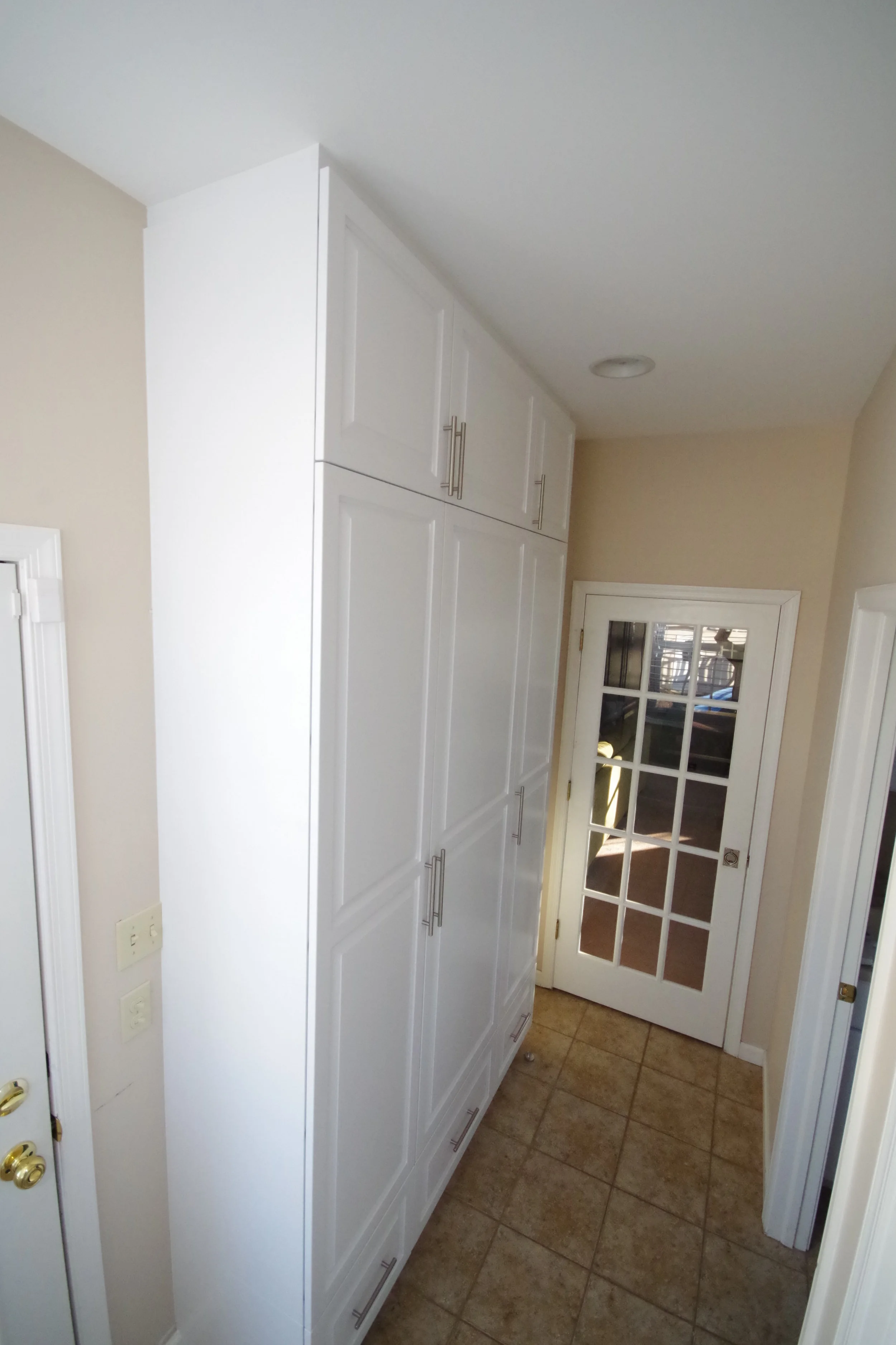  Mudroom family coat closet keeps the area clean and uncluttered. 